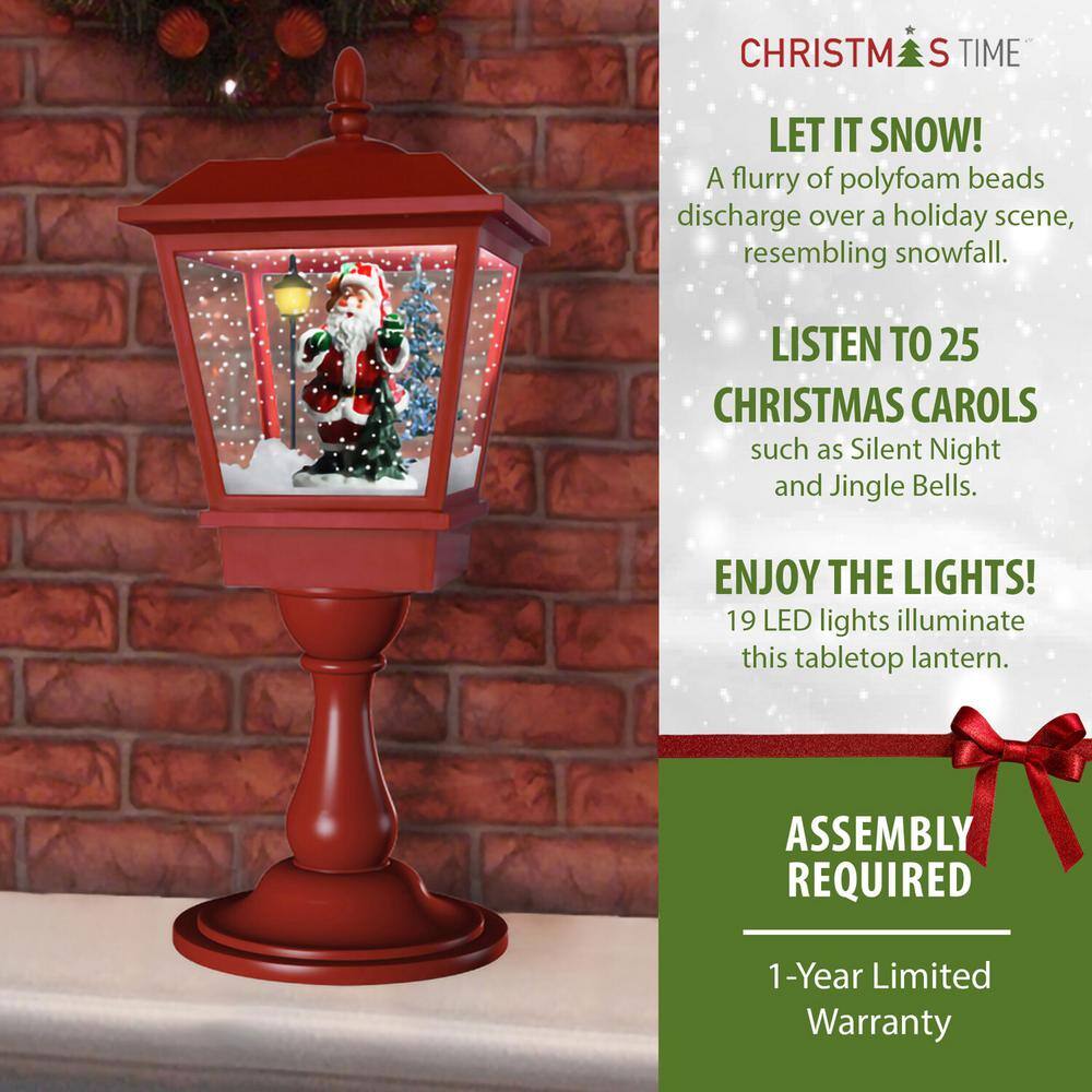 25 in. Christmas Tabletop Musical Snowy Lantern with Sant Scene, Cascading Snow and Christmas Carols - Hercitys